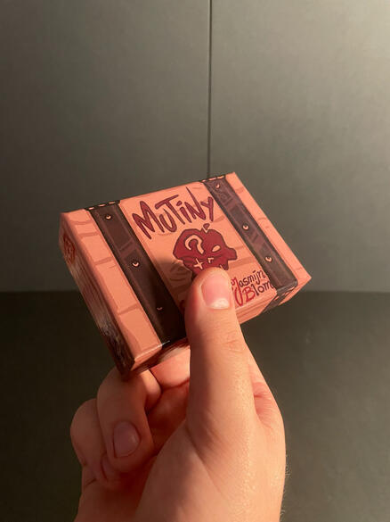 Mutiny box held up close at a slight angle.