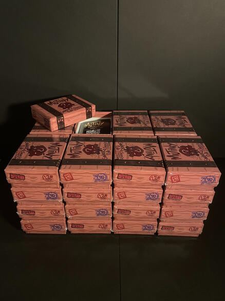 32 Stacked Mutiny boxes, one of which being open.